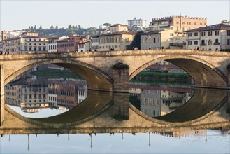 Italy, Tuscany, Florence, Cityscape reflected in Arno river