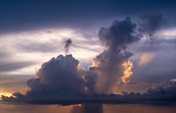Storm cloud at sunset