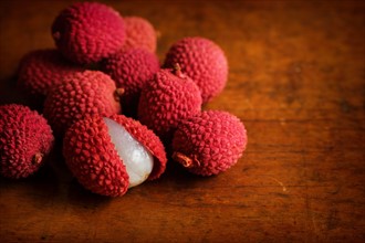 Organic lychee on wooden table