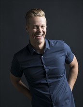Portrait of blond man laughing