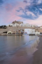 Spain, Valencian Community, Peniscola, Waterfront town at sunset