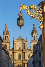 France, Grand Est, Nancy, Ornate street light with Nancy Cathedral in background