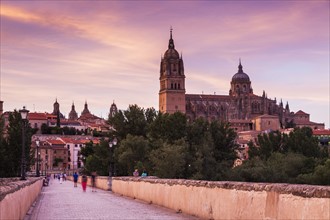 Spain, Castile and Leon, Salamanca, Catedral Nueva de Salamanca and Roman Bridge in long exposure