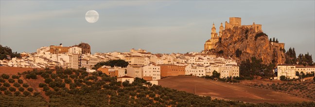 Spain, Andalusia, Olvera, Panoramic view of townscape with moonrise