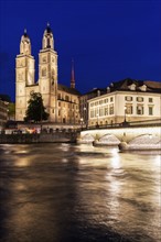 Switzerland, Zurich, Grossmunster Church and Limmat River at night