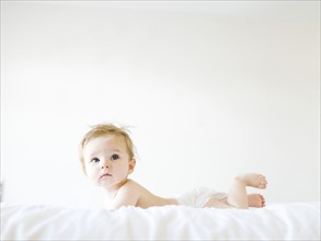 Baby girl (6-11 months) playing in bedroom