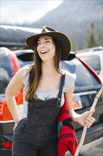 Outdoor portrait of smiling woman wearing hat