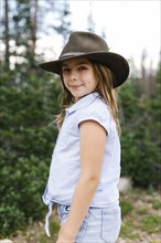 Outdoor portrait of girl (8-9) in hat