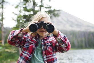USA, Utah, Midway, Portrait of boy (6-7) looking through binoculars