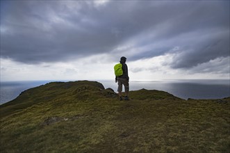 Ireland, County Donegal, Hiker looking at Donegal Bay long Wild Atlantic Way
