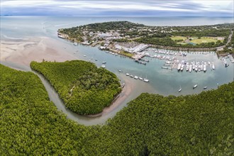 Australia, Queensland, Aerial view of coastline with harbor