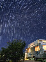 Australia, Queensland, Night sky over camper trailer