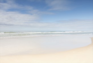 Empty beach on sunny day