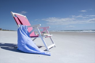 Deckchair on empty beach