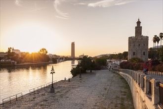 Spain, Andalusia, Seville, Golden Tower against sunrise