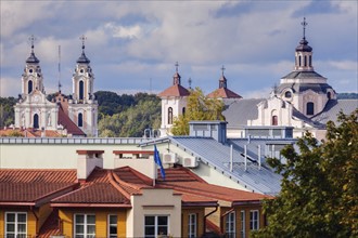 Lithuania, Vilnius, Residential building with churches in background