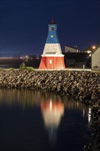Canada, Nova Scotia, Cheticamp, Lighthouse reflecting in water