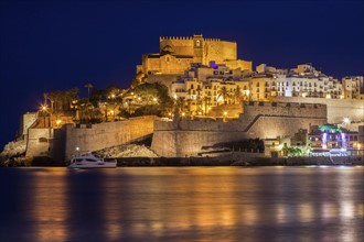 Spain, Valencian Community, Peniscola, Waterfront with fortified wall at night