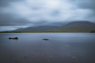 Ireland, Galway County, Connemara, Clouds over lake
