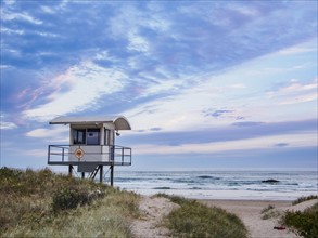 Australia, New South Wales, Lifeguard hut against moody sky