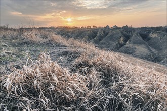 Ukraine, Dnepropetrovsk region, Dnepropetrovsk city, Landscape with dry grass at sunset