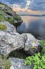 Ukraine, Dnepropetrovsk Region, Dnepropetrovsk District, Voloske, Rocky shore of lake at dawn