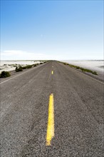 USA, Utah, Wendover, Bonneville Salt Flats, Blue sky over empty road