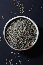 Overhead view of brown lentils in bowl