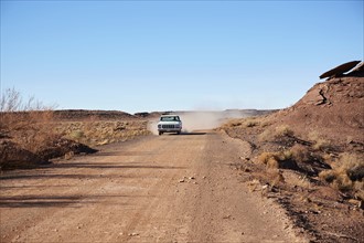 USA, Arizona, Pick up truck on dusty road