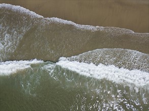 Aerial view of surfs on sea coast
