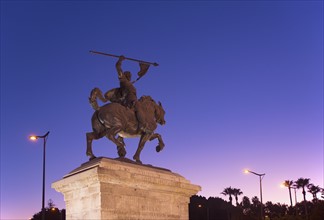 Spain, Andalusia, Seville, Statue against clear sky at dusk