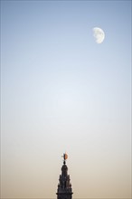 Spain, Andalusia, Seville, Moonrise over Giralda Tower