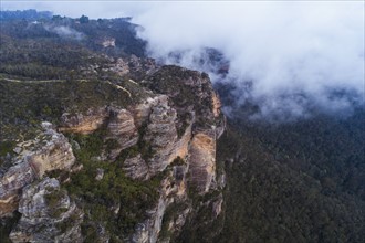 Australia, New South Wales, Katoomba, Large rocks in clouds