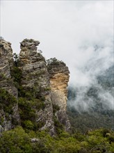 Australia, New South Wales, Katoomba, Large rocks and mountains in clouds