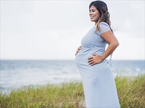 Pregnant woman wearing blue dress