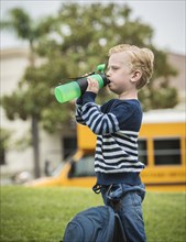 Boy drinking from bottle