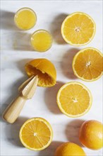 Sliced oranges with juicer