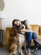 Woman on sofa with dog