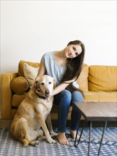 Woman on sofa with dog