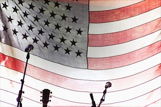 Microphones and guitar by American Flag