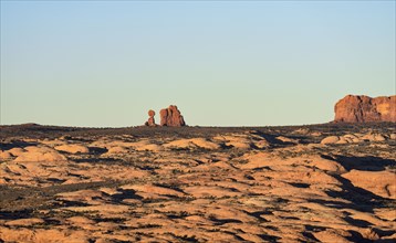 Sand dunes and Balanced Rock in Arches National Park, Utah, USA