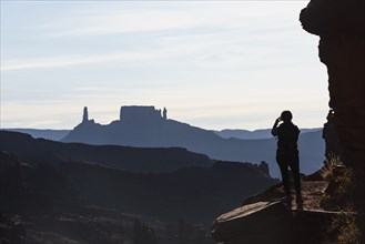 Woman's silhouette by Fisher Towers in Utah, USA