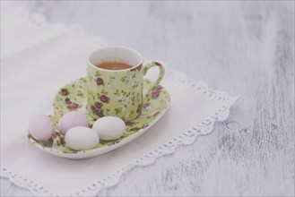 Eggs on floral plate with matching cup of tea