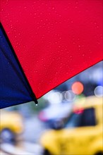 Close up of umbrella on rainy day