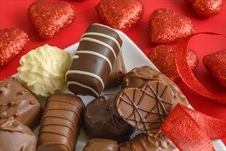 Assorted chocolates with red hearts