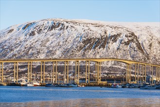 Bridge by snow covered hill in Tromso, Norway