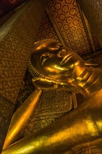 Gold statue of Buddha in Bangkok, Thailand