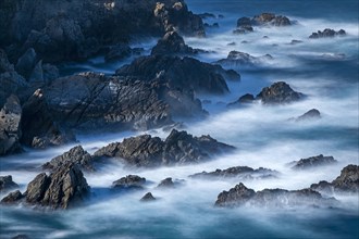 Long exposure shot of rocks in sea at Carmel-by-the-Sea, California, USA