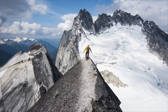 Man mountain climbing in Bugaboo Provincial Park, British Columbia, Canada