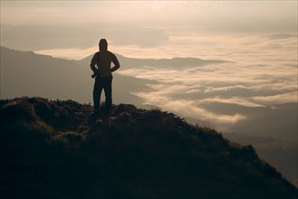 Silhouette of man in the Carpathian Mountain Range at sunrise
